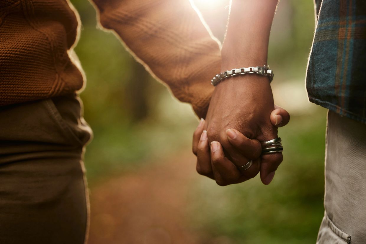 Close up photo of holding hands