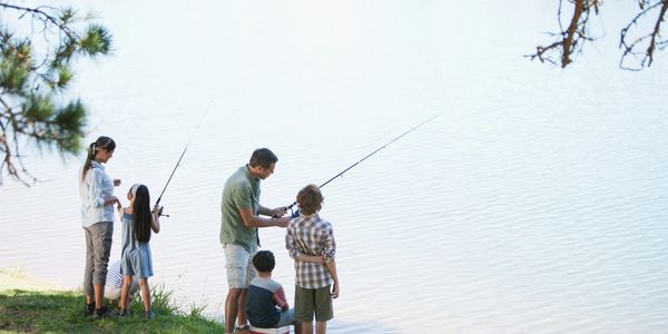 Family enjoying a guided fishing adventure in Baltimore, MD.