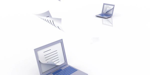 Laptops exchanging digital documents wirelessly in a minimalistic white space.