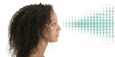 Woman speaking with sound wave graphic.