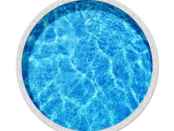 Top view of a round swimming pool with clear blue water.