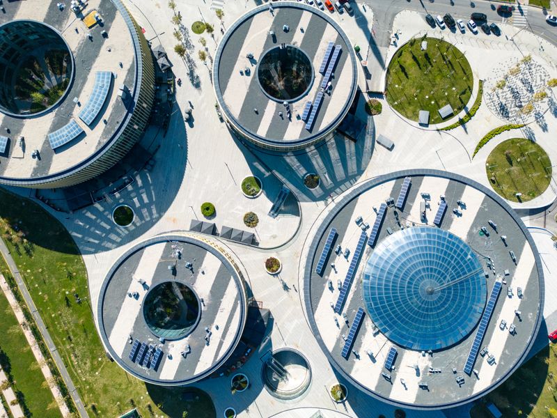 Aerial view of solar panels on a rooftop of a residential buildings. KUZEY YAKASI, It brings the largest park of the region to Basaksehir. It is an office project developed by Emlak Konut GYO (TOKİ subsidiary) in Basaksehir district. The project, which consists of 10 blocks in total, includes a congress center, commercial blocks and office blocks. TOKİ is a public institution affiliated with the Ministry of Environment, Urbanization and Climate Change of the Republic of Turkey, established specifically for the purpose of social housing production.