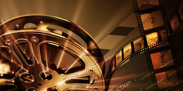 Close-up of a vintage film reel with film strips and countdown frames.