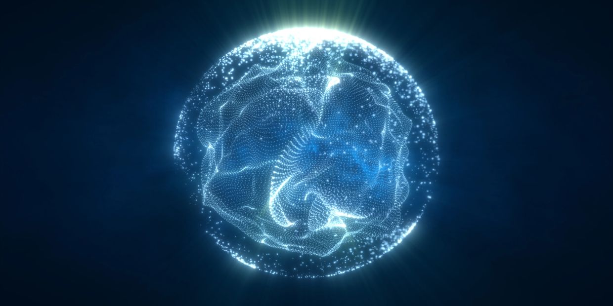 Glowing digital sphere made of interconnected particles against dark background.