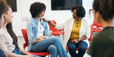 A group therapy session with supportive interaction between participants.