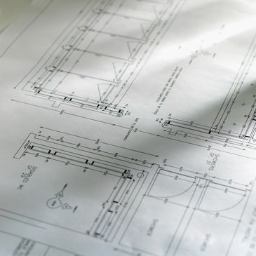 Architectural blueprint with detailed measurements and door designs.