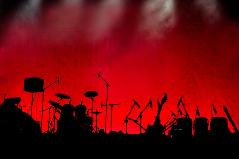 A stage in silhouette before a concert