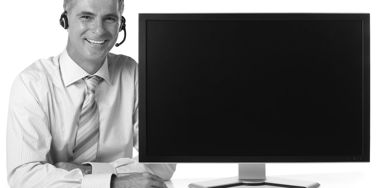 Professional working from home with tech support.