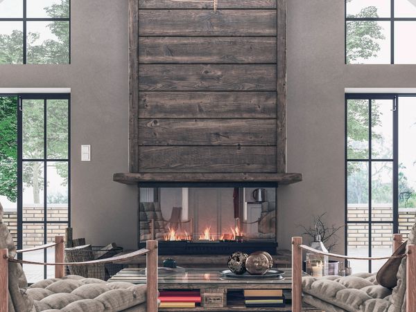 Modern living room with a wooden fireplace and cozy seating.