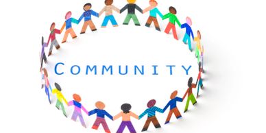 Paper cutout people holding hands in a circle with 'COMMUNITY' text.