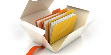 An open white box containing colorful file folders organized inside.