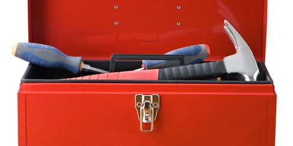 Red toolbox with tools inside.