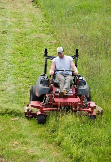  Mowing tall grass for elderly Farmers
