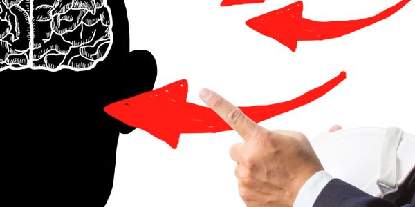 Hand pointing at a brain illustration with red arrows indicating focus.