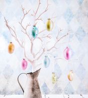 Easter eggs hanging on branches