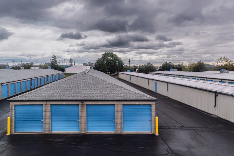 Group of Storage units with Blue Garage Doors