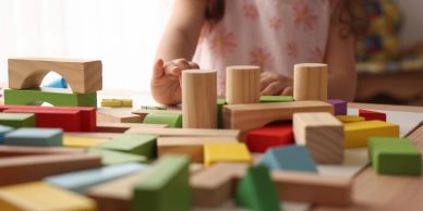 Child playing with wooden blocks.