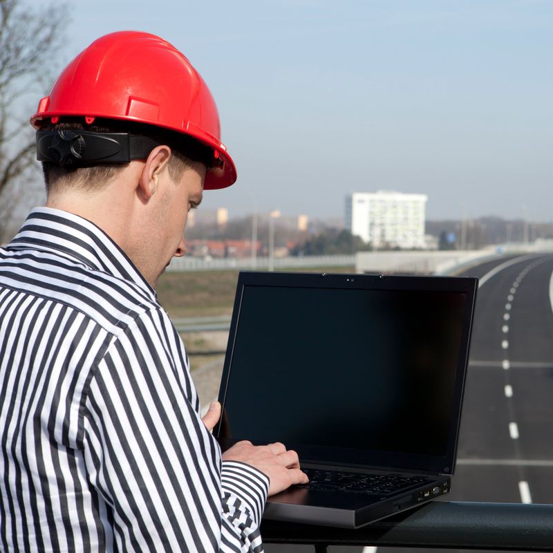 Young enineer at bridge looking at road construction.   If you want more images with business concepts please click here.
