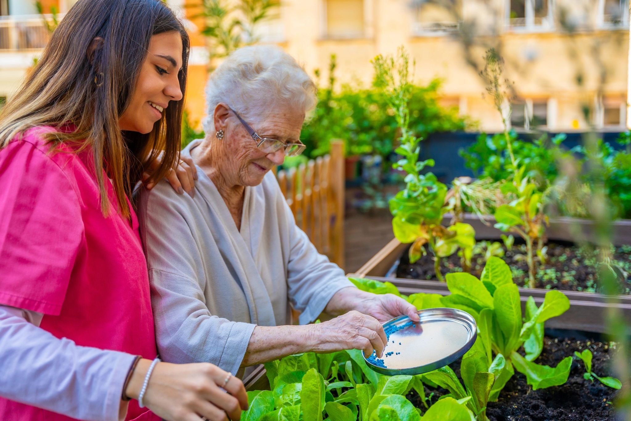 Senior and caregiver sharing a warm moment in a home-like setting