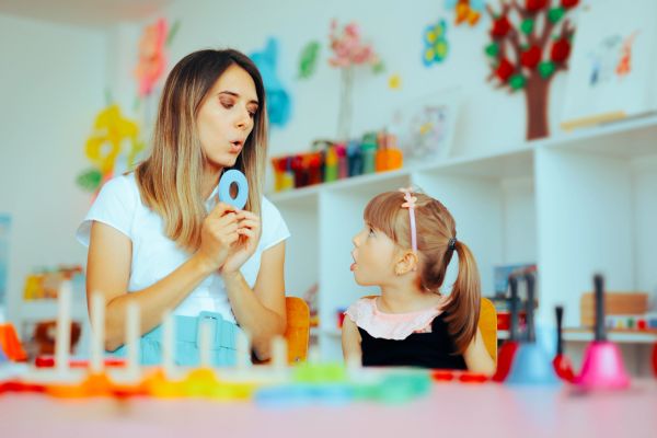 Speech Pathologist with female client aged 5