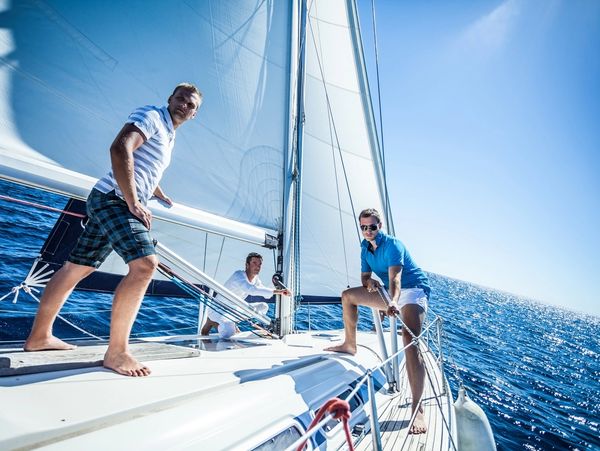 Small group of friends enjoying in the boat