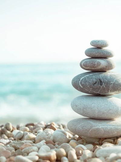Stacked rock tower on rocky beach