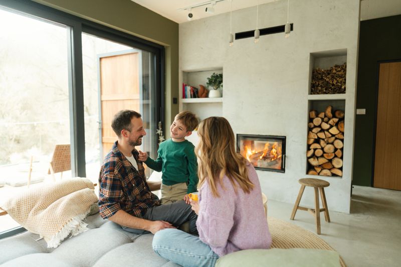 Portrait of a beautiful cheerful family with a young boy, spending quality time together in their home