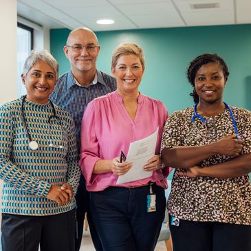 Group of diverse healthcare professionals smiling.