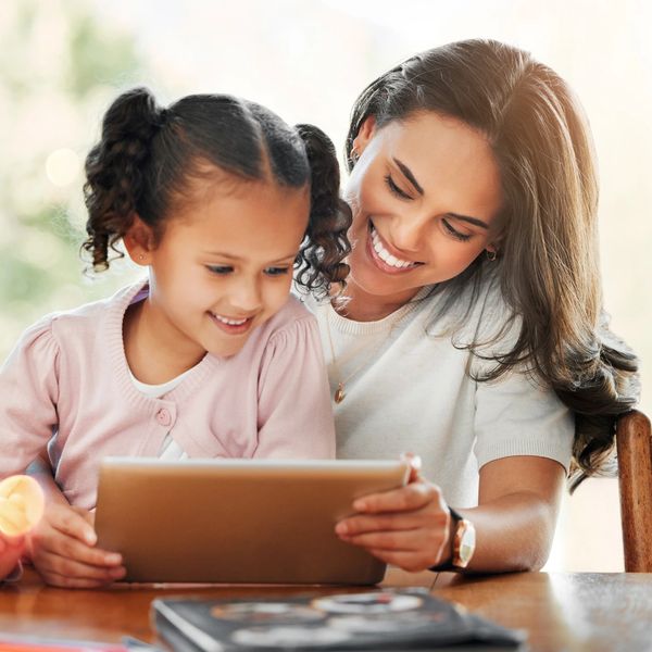 Student and parent working on a tablet.