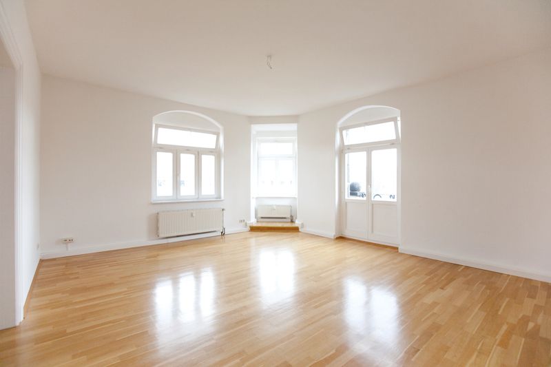 empty living room in a loft with windows