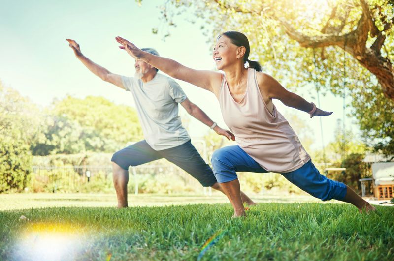Senior couple, outdoor and exercising for health, fitness or wellness in grass, healthy or happy. Retired, elderly and enjoying retirement with workout, stretching and backyard for body, man or woman