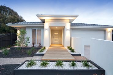 Modern house entrance with soft lighting.