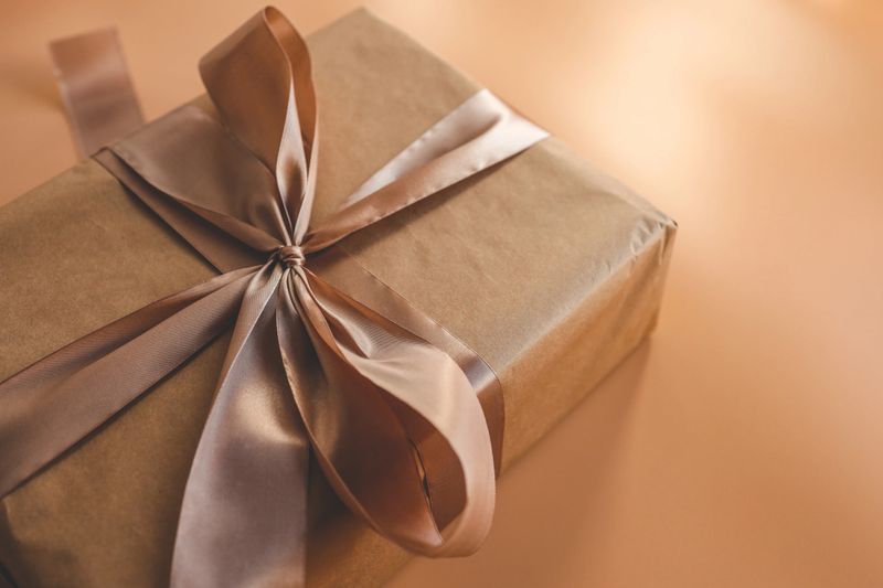 Gold gift wrapping close-up bow.