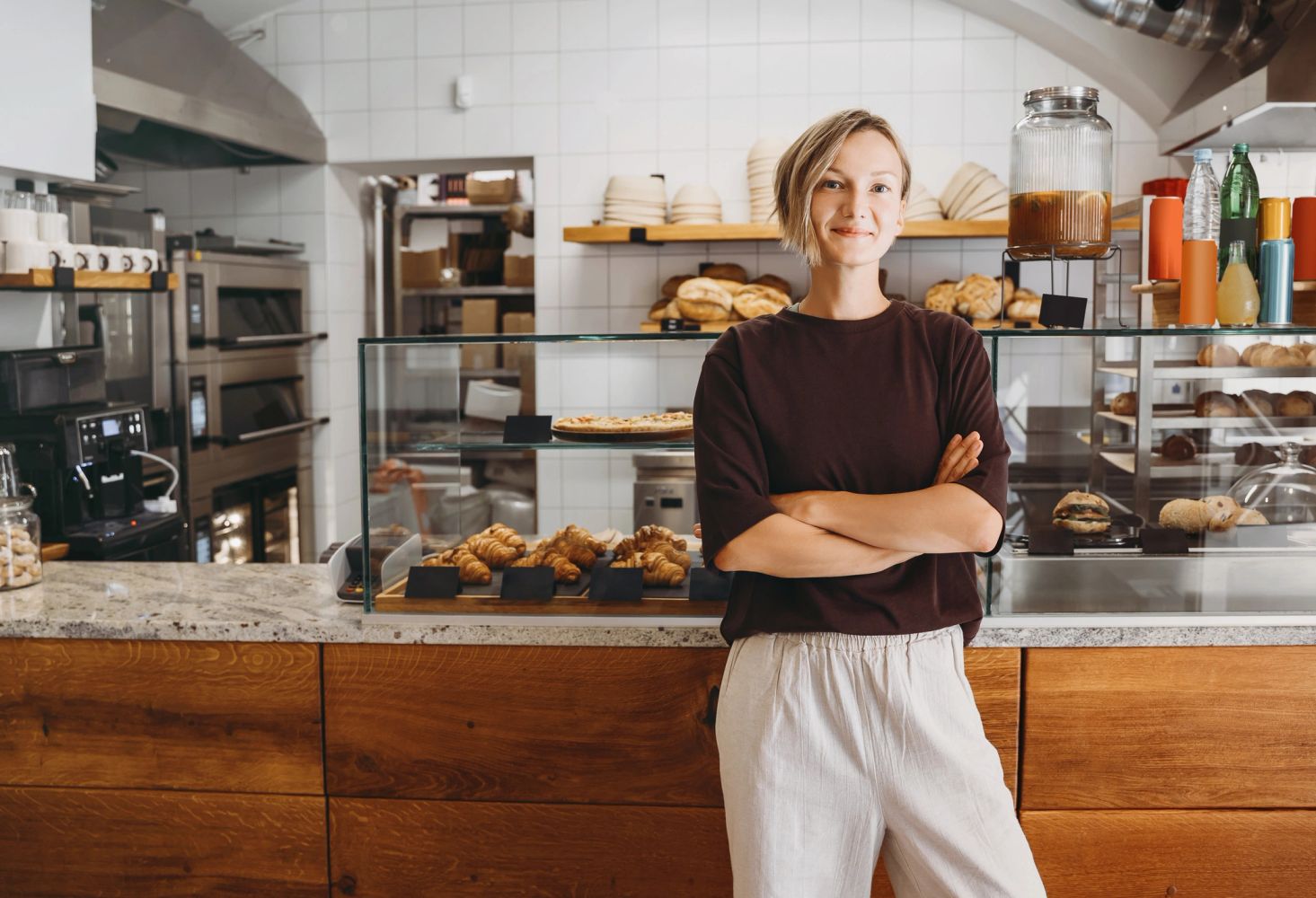 Small business owner standing confidently in her shop
