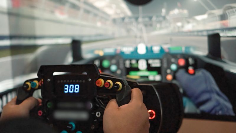 Close up hand Young asian man playingCar racing video game.