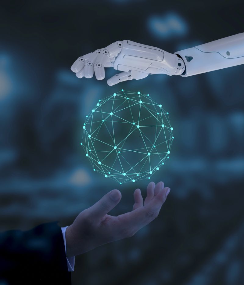 Human and robot hands touch the cyber network, the concept of human and AI collaboration in the virtual world.