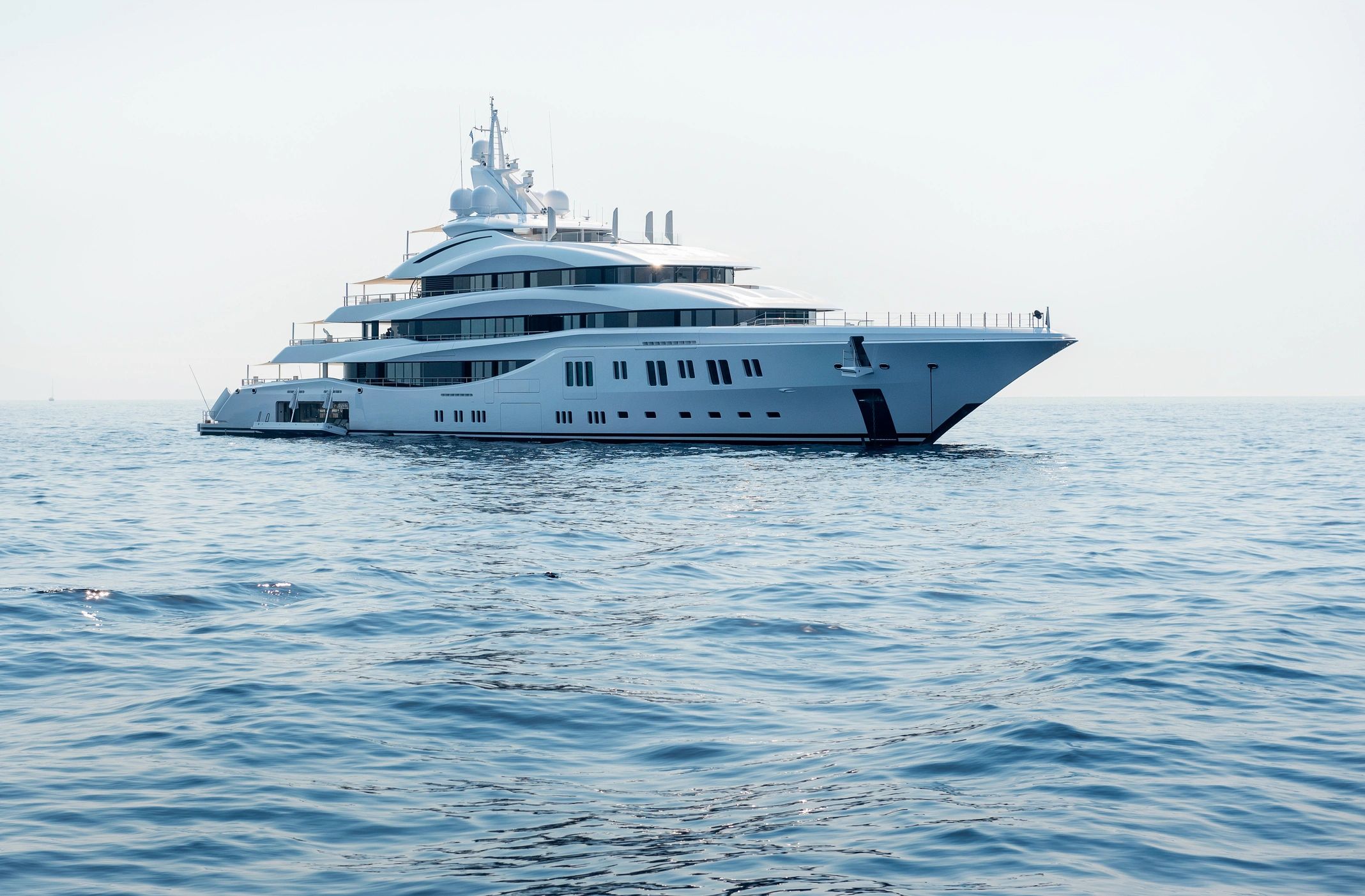 A large luxury yacht sailing on calm waters.