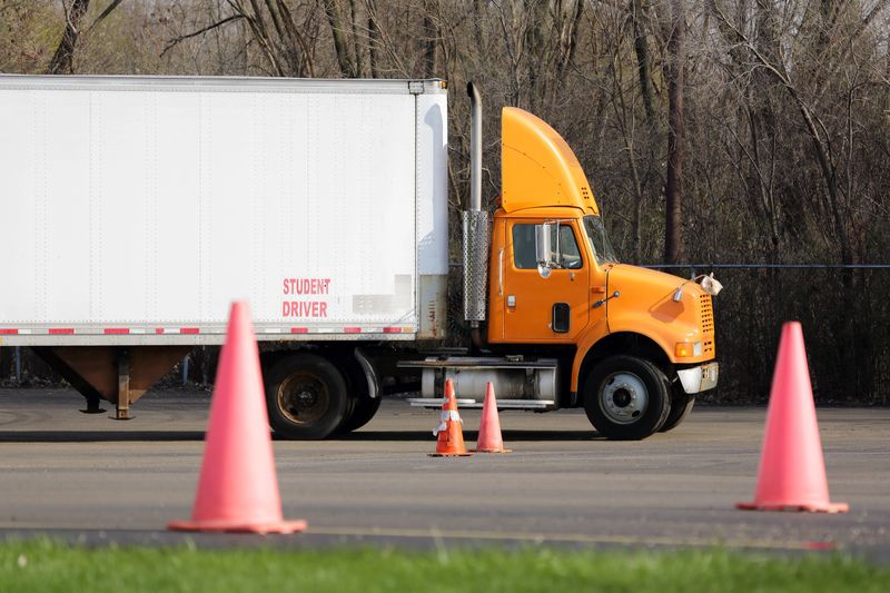Student truck driver trains in parking maneuvers