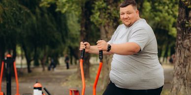 An obese white male in his garden.