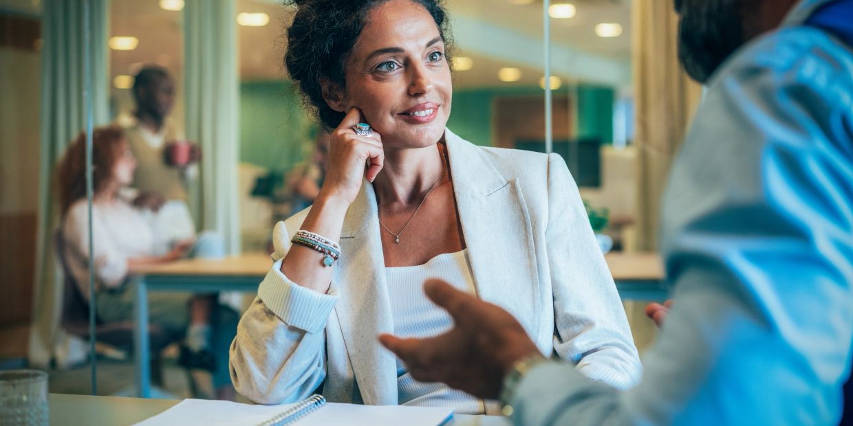 Woman listening attentively in a meeting.