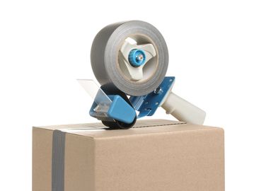 Packing tape dispenser on a sealed cardboard box.