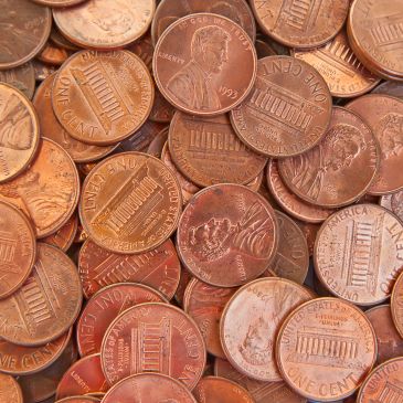 Pile of U.S. pennies scattered.