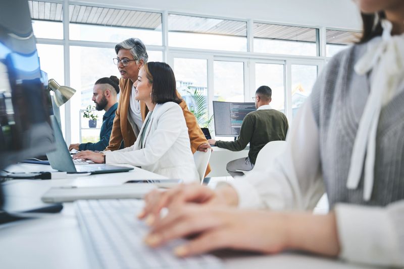Programming, training and mentor with business people in office for cyber security, coding and developer.