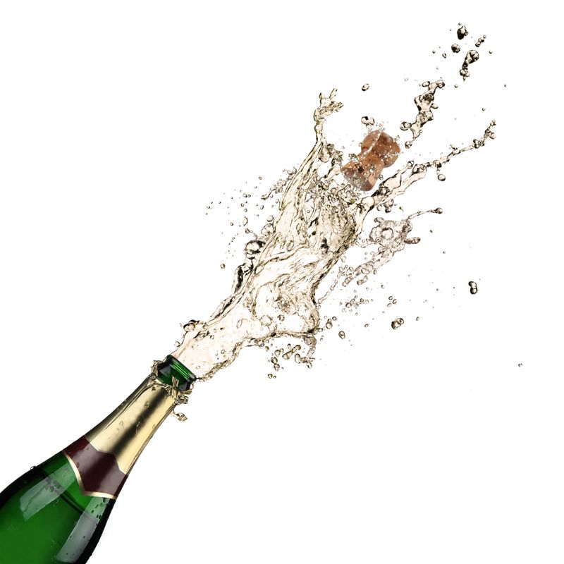 Close-up of champagne explosion. Celebration theme.