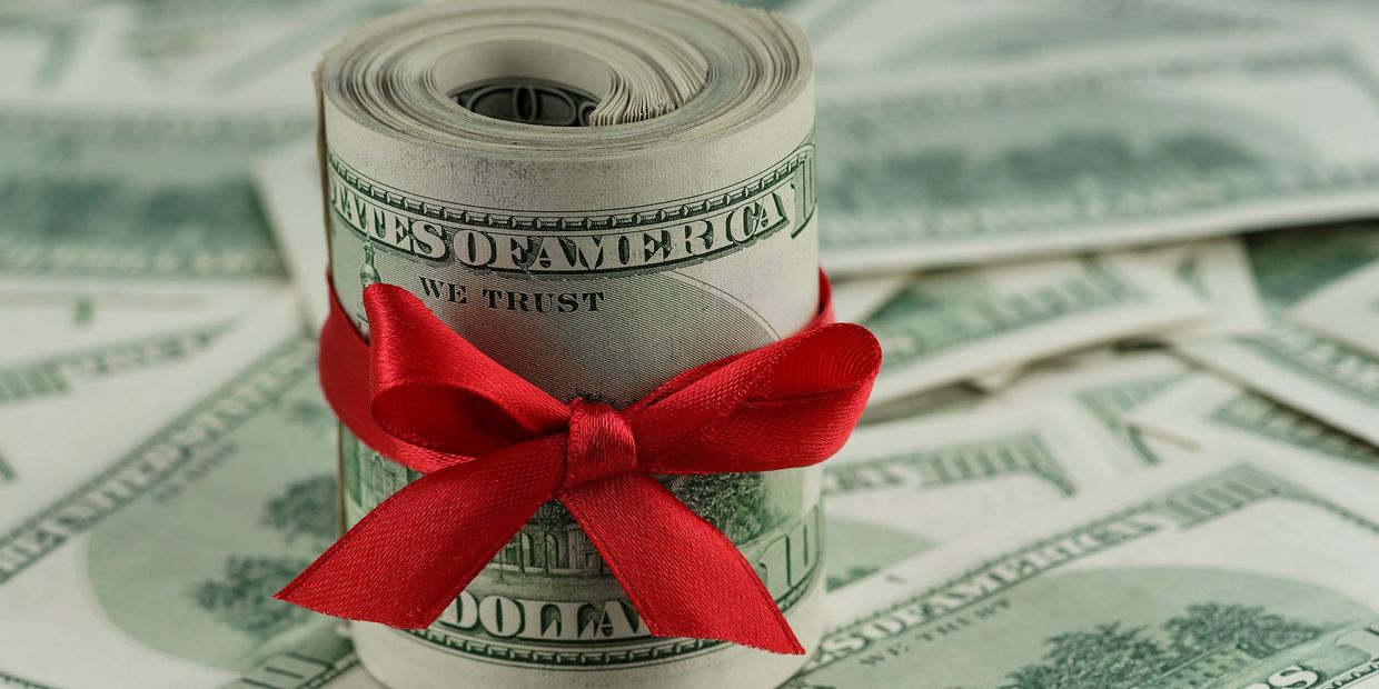 money 100 dollar bills in a bow: symbolizing fast asset-based financing