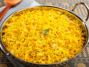 Fluffy, fragrant yellow rice cooked with aromatic spices for a flavorful and satisfying side dish.
