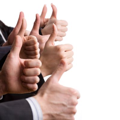Multiple hands showing thumbs up against a white background.