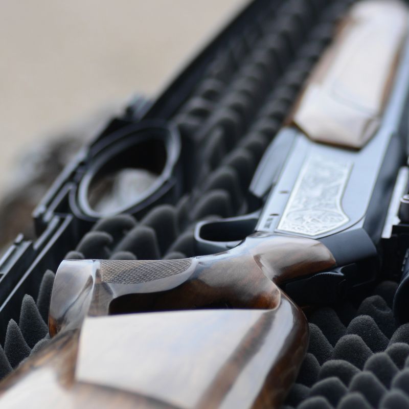 Custom made walnut wood stock monted on a modern hunting rifle