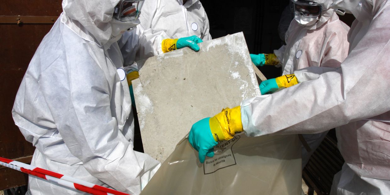 Taylor-Way contractors removing asbestos contaminated drywall

