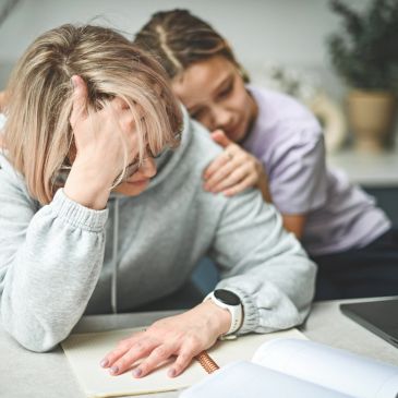 Woman showing support to a stressed person.